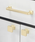 Sweet 10 Pack 5 Inch Brushed Brass Kitchen Cabinet Handles Gold Toned Drawer Pulls Featuring Smooth Edges For Cupboards And Home Cabinetry Upgrades 128mm Easy Mount shown on white cabinetry.