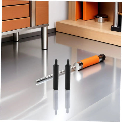 Smooth As Butter Soft Close Dampers 6 Pack Hydraulic Buffer Inserts For Drawers on a reflective surface with a metallic tool.