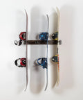 Hella Durable Solid Hardwood Ski And Snowboard Wall Rack holds four pairs with snowboards mounted in a clean garage.