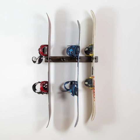 Hella Durable Solid Hardwood Ski And Snowboard Wall Rack holds four pairs with snowboards mounted in a clean garage.