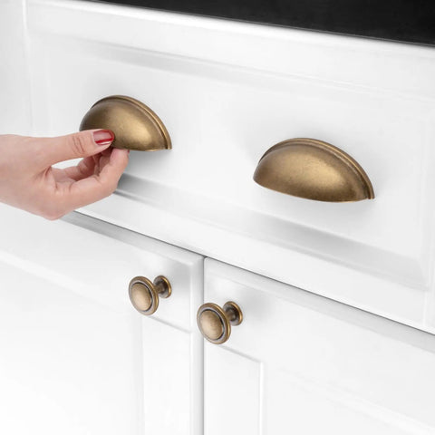Old School Cool Heavy Duty 10 Pack 3 Inch Cabinet Pulls Antique Brass Vintage Hardware Bin Cup Drawer Handles being installed on white cabinet.