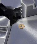Close-up of a 4 Inch 3-Jaw Lathe Chuck Plain Back Hardened Semi-Steel With Wrench Includes 2 Sets Of Hardened Jaws Internal And External