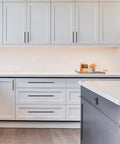 Modern kitchen cabinets with 10 Pack Matte Black Cabinet Pulls 5 Inch 128mm Hole Centers Kitchen Cabinet Handles installed.