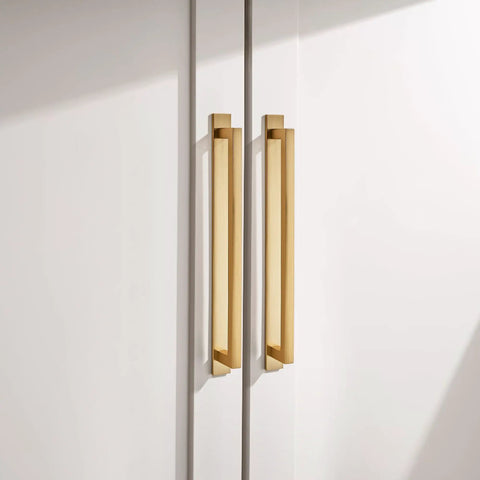 Kickass Square Cabinet Handles 10 Pack Featuring Three Inch Screw Spacing And Brushed Champagne Gold Zinc Alloy Furniture Pulls For Kitchen Cabinets Dressers And Closets close-up on two square cabinet handles.
