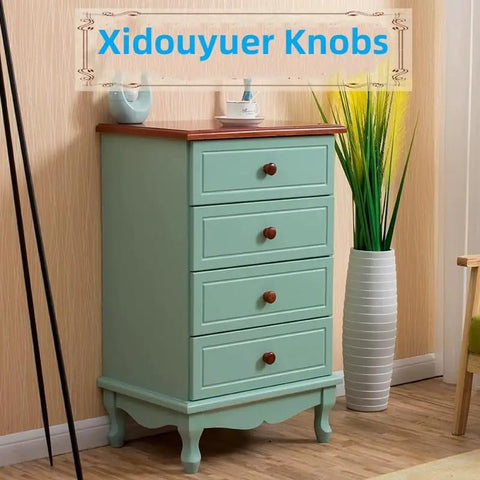 Ten Pack Round Wood Drawer Knobs Warm Red Brown Finish on turquoise dresser with plants, enhancing kitchen or home decor.
