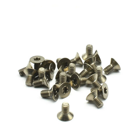 Premium Grade 2 Titanium Countersunk Screw Set Crisp Torx Drive Metric Fasteners for Garage Builds and Bike Mods Rock Solid Dark Grey Finish 12 Piece Pack, showing a pile of twelve screws.