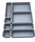 8 Piece Interlocking Drawer Organizer Trays Set In Light Gray Plastic, Modular Storage Bins for Versatile Drawer Arrangement.