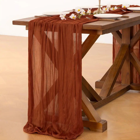 Rustic Terracotta Table Runner Hand Dyed From Breathable Cheesecloth on wooden table, 35"W x 120"L, ideal for elegant dining setups.