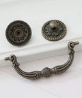 Knockout Antique Bronze Drop Bail Dresser Pull With 3 Inch Hole Centers Rustic Cabinet Handle, heavy duty vintage hardware detail.