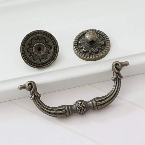 Knockout Antique Bronze Drop Bail Dresser Pull With 3 Inch Hole Centers Rustic Cabinet Handle, heavy duty vintage hardware detail.