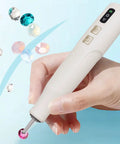Badass Cordless Electric Pickup Pen With Reliable Vacuum Grip To Snag Loose Bits Zero Sweat For Desk Projects Plus Bright Light and Smooth Angled Tip For Crisp Workflows held in hand with shiny gems.