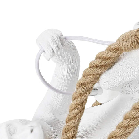 Close-up of resin monkey grip with hemp rope on Monkey Pendant Light Fixture With Hemp Rope chandelier, industrial retro style.