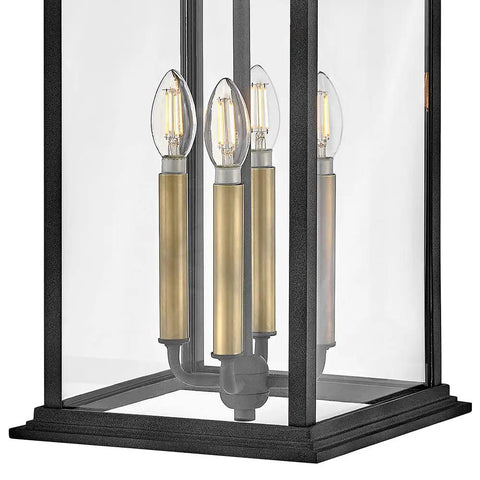 Close-up view of Extra Large Outdoor Wall Lantern Featuring Heritage Brass And Aged Zinc Finish with clear glass panels.
