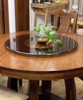 Premium Tempered Glass Lazy Susan Turntable And Slick Swivel Serving Tray on a wooden dining table with decorative plant.