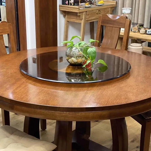 Premium Tempered Glass Lazy Susan Turntable And Slick Swivel Serving Tray on a wooden dining table with decorative plant.