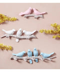 Five Hook Wall Mounted Coat Rack With Decorative Bird Design Built To Hold Heavy Gear Smoothly Perfect For Entryway And Bedroom Storage To Keep Your House Neat And Seriously Slick In Blue featuring colorful birds on branches.
