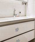 Bee Shape Brass Drawer Knobs Set Of 4 With Gold Finish for cabinets installed on a white bathroom drawer