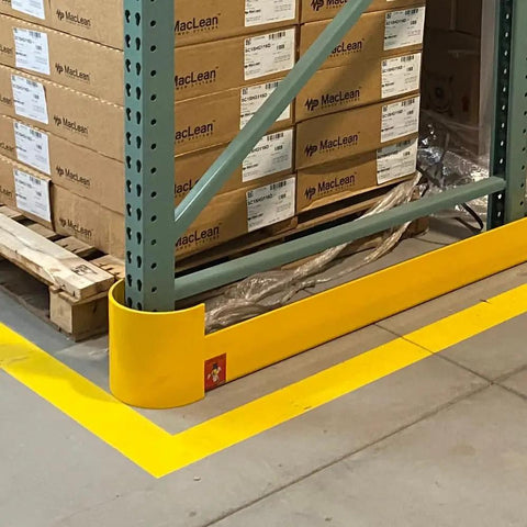 48 Inch Heavy Duty Right Hand Pallet Rack Protector Built Like A Tank Featuring Rock Hard Steel Half Moon Guard and Sloped Bracket installed near pallets.
