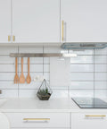 10 Pack Brushed Brass Knurled Cabinet Handles 5 Inch Center to Center Gold Kitchen Cabinet Pulls installed on white cabinets