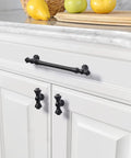 Premium Matte Black Cabinet Knobs For Kitchen And Dressers Featuring Durable Zinc Construction on white cabinet doors.