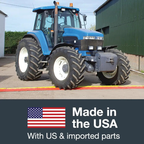 Blue tractor on Drive-Over Cable Protector One Channel With Drop-In Design For 2.25 Inch Lines Beefy Heavy-Duty Hose And Cable Ramp 23k