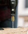 Mini Cordless Rotary Tool Kit Featuring Killer Performance At 15000 Rpm drilling into wood with precision using a drill bit.