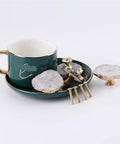 Fresh White Geode Cabinet Knob Set With Slick Gold Plated Crystal Drawer Pulls And Easy Install Gemstone Cupboard Handles For Your Kitchen Bathroom Upgrade on green plate with cup.