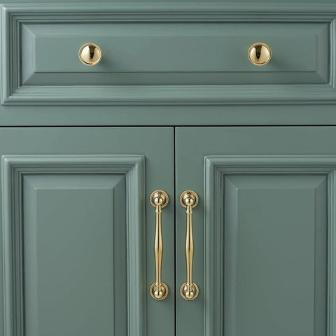 Solid Brass Cabinet Pull And Drawer Knob With Modern Grooved Base Design in antique brass finish on green kitchen cabinet
