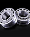 Heavy Duty Self Aligning Spherical Roller Bearings Rock Solid For Tough Industrial Machinery And Conveyor Lines 40 Mm X 90 Mm X 23 Mm Premium Chrome Steel Workhorse Grade Shaft Support Unit displayed at an angle showing spherical rollers.
