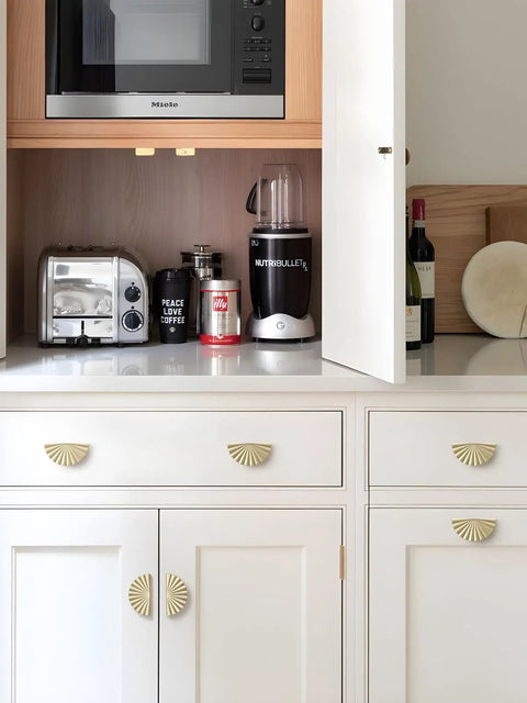 Top Shelf 10 Pack Brushed Gold Cabinet Pulls With A Slick Flat Brass Finish And Hella Sturdy Zinc Alloy Build 3 Inch Center To Center Drawer Handles installed on white kitchen cabinets.