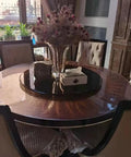 Black Tempered Glass Lazy Susan Turntable Serving Tray, 28 Inch Round Base With Heavy Duty Swivel Mechanism on dining table.