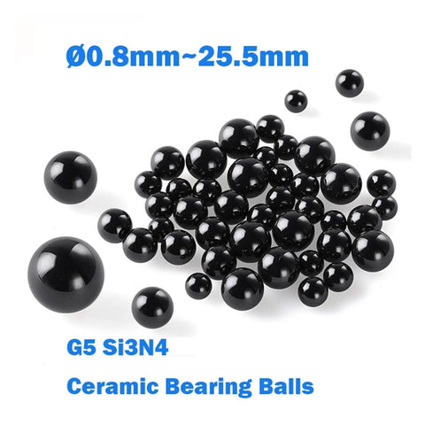 G5 Precision Silicon Nitride Ceramic Ball Bearings 50 Piece Set 15.875 Millimeter Diameter black balls in varying sizes on white background.