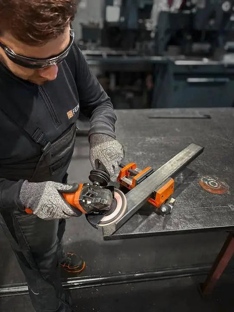 Beefy 1700Watt 125Mm Corded Angle Grinder Featuring Variable Speed Dial And Lockdown AntiVib Handle for cutting metal.