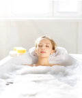 Woman relaxing in bath with bubbles using Adjustable Overflow Drain Cover For Deeper Baths Up To 4.5 Inches, Silicone White Tub Upgrade Accessory For A Richer Soak And Longer Bath Time.