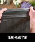 Hands holding Heavy Duty Weed Barrier Fabric 4 Ft By 50 Ft Durable Woven Ground Cover for Driveways, Garden Beds, Landscaping