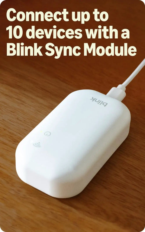 Sync Module Core for Outdoor 2K Plus Wireless Smart Security Camera With Sharp 2K Video, Black system on wooden surface