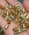 Ten Piece SMT Soldering Copper Nuts And Precision Bearing Sleeves For PCBs Threaded Through Hole welded brass hardware in hand.