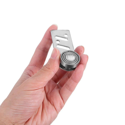 Heavy Duty Stainless Steel Sliding Door Rollers 4 Pack featuring Precision Ball Bearings 23mm axle held in hand.