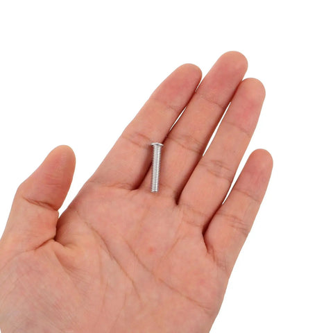 Hand holding a small rivet from 80 Piece Pro Grade Auto Dent Remover Tool Kit With 4mm Aluminum Rivet Nuts For Precision Sheet Metal Repair