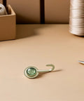 Pack Of 4 Self Adhesive Wall Hooks Featuring A Vintage Diamond Design sitting on a neutral surface with sewing tools.