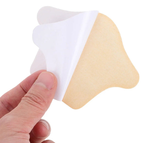 Game Changing Heel Grips And Liner Cushions To Tighten Up Loose Shoes Anti Chafing Beige Shoe Inserts. Hand holding cushion.
