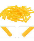 Pile of 200 Pack Yellow Plastic Wall Anchors Kit Self Drilling Ribbed Anchors for Drywall with close-up details