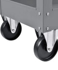 Rock Solid Heavy Duty Steel Storage Cart With Two Roomy Deep Trays Carries Five Hundred Pounds Flawlessly For Workshop Garage Or Warehouse Tool Organization And Effortless Rolling In Gray wheels close-up view.