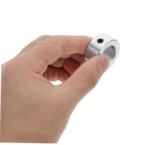 Hand holding a Solid Steel Locking Ring Kit With Hex Spanner For Secure Shaft Collar In Industrial Machinery Drive Shafts Easy Install Stable Fit Compatible With Various Sizes Gear Stays Locked Down Tight No Fretting Needed Just Rock Your Rig Daily Fo Sho