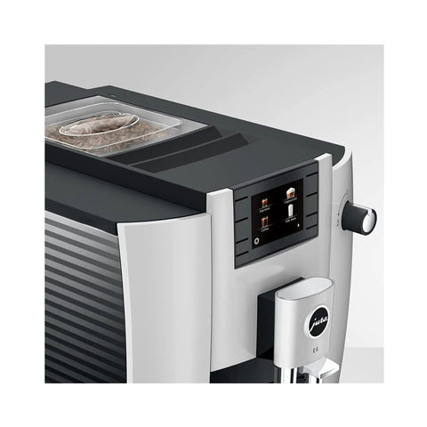 Premium Automatic Espresso Machine In Sleek Platinum Finish Packs In One Touch Brewing showing control panel and bean container.