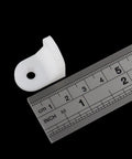 Premium Plastic L Shelf Brackets For Sturdy Wall Mounting Built Tough With Durable Polymer Corners in white with ruler for size reference.