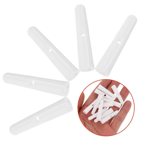 Top Shelf Folding Umbrella Repair Kit With Durable White Plastic Tail Beads And Quick Setup Design For Hassle Free Bone Coverage And Game Changing Weather Defense Slick Replacement Caps showing white plastic caps for umbrella repair.
