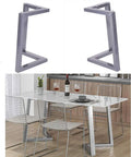 No Sweat Install Rock Solid Black V Shaped Table Legs For Kitchen Or Home Office Heavy Duty Iron Desk Frame With Adjustable Floor Levelers 28 Inch Height Built Like A Tank displayed with modern dining setup.