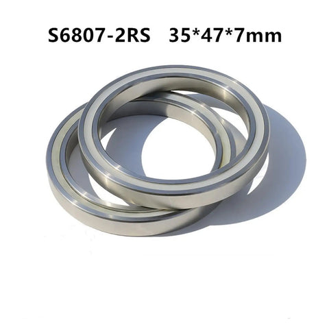Top Shelf 316L Stainless Steel Deep Groove Ball Bearings S6807 Double Rubber Sealed 35X47X7 mm set of two showing smooth surface.
