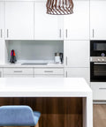 Modern kitchen with satin nickel cabinet pulls and white cabinets, featuring 30 Pack 4 Inch Satin Nickel Cabinet Pulls For Kitchen Cabinets With Six And Three Eighths Inch Overall Length And Four Inch Center To Center Mounting One Half Inch Diameter And One And Quarter Inch Projection.